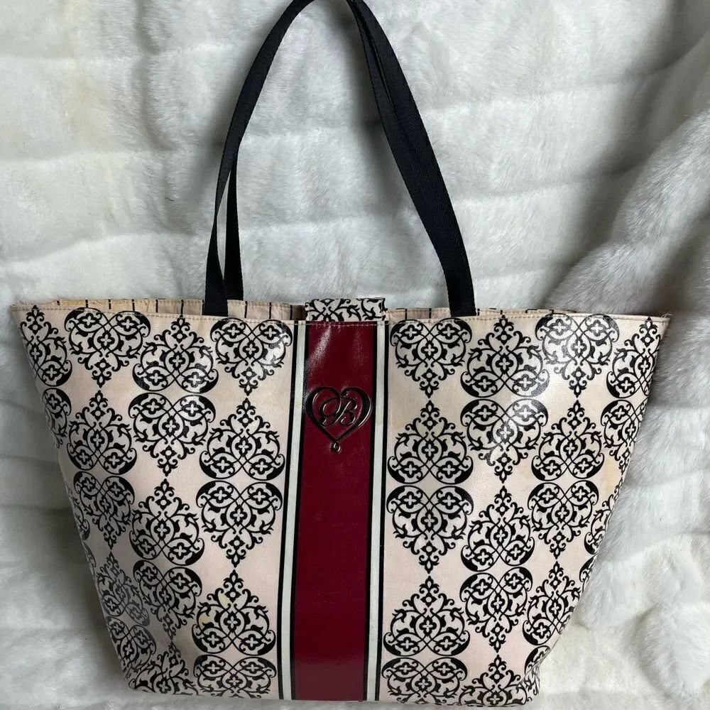 Brighton pink & Black coated canvas tote embellished with silver tone accent.